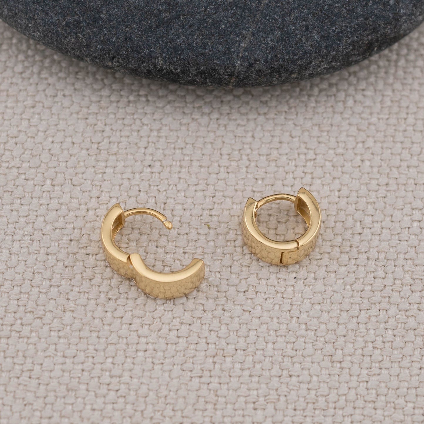 Minimalistic thick small huggie hoop